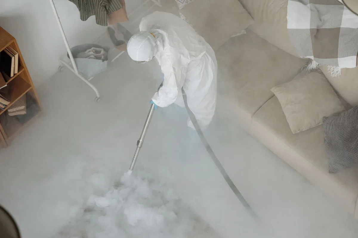 Biohazard cleanup technician in protective equipment, Humansville, MO